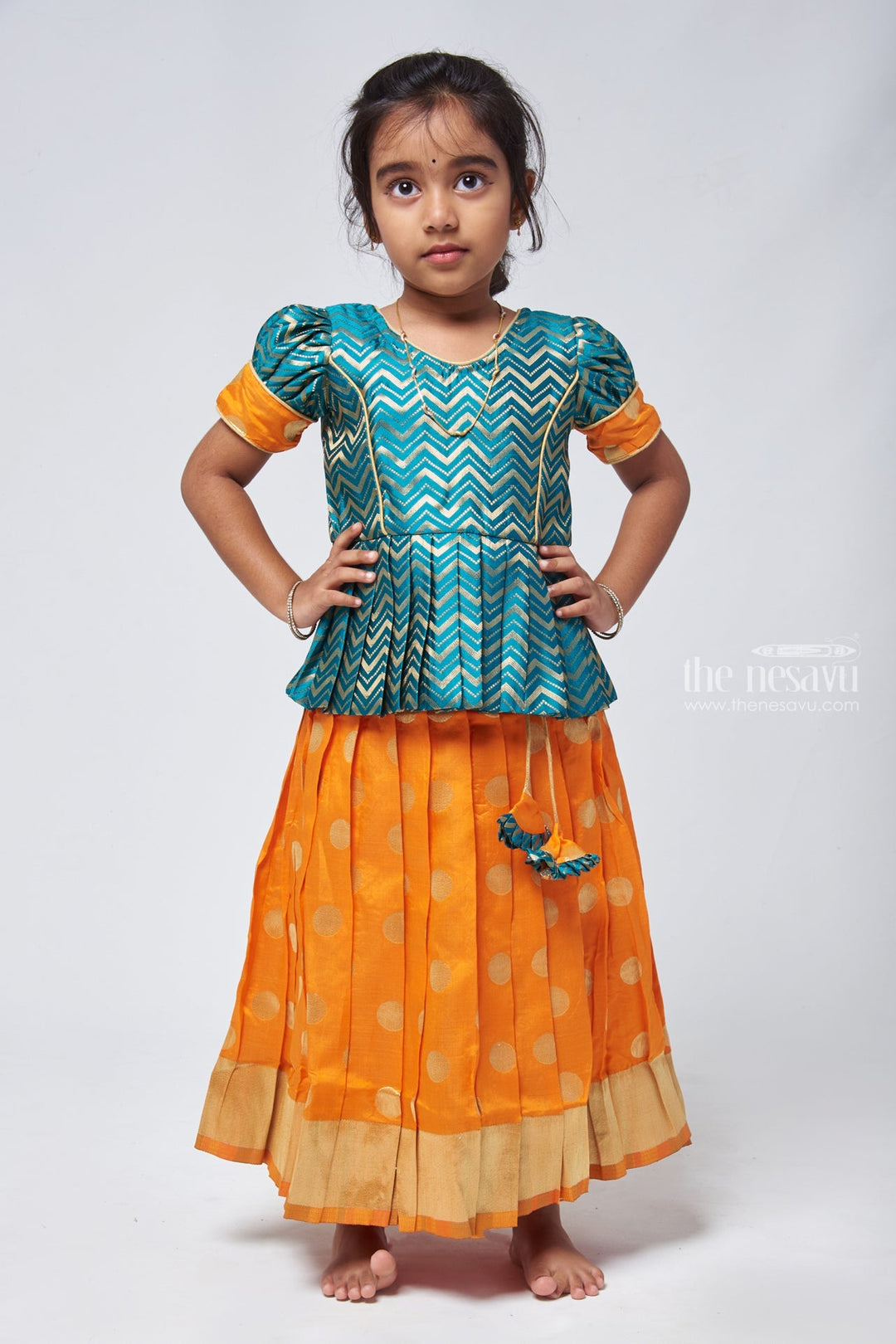 The Nesavu Pattu Pavadai Vibrant Zig Zag Green Peplum Blouse with Zari Butta Orange Pattu Pavadai: Traditional Festive Charm Nesavu 14 (6M) / Orange / Small Border GPP304B-14 Pattu Pavadai Latest Design | Pattu Pavadai for Festivals | The Nesavu