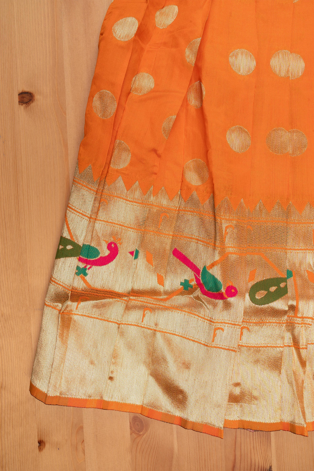 The Nesavu Pattu Pavadai Vibrant Zig Zag Green Peplum Blouse with Zari Butta Orange Pattu Pavadai: Traditional Festive Charm Nesavu Pattu Pavadai Latest Design | Pattu Pavadai for Festivals | The Nesavu