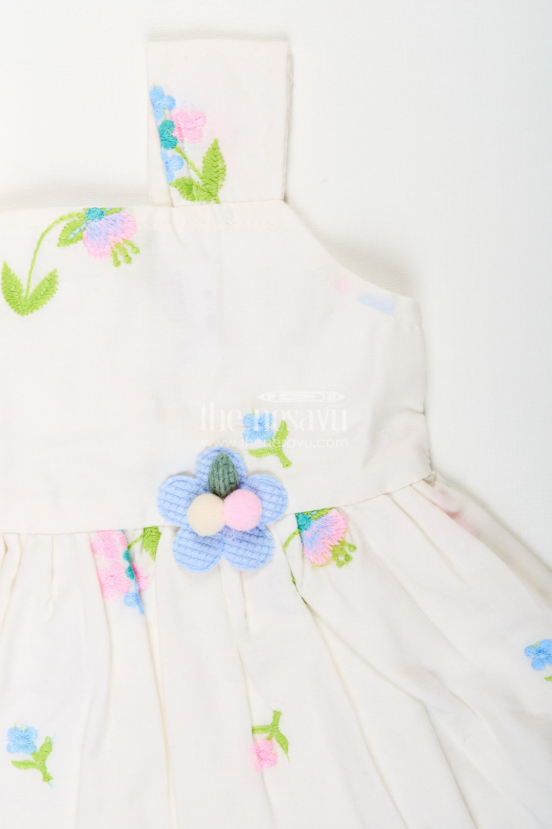 The Nesavu Baby Cotton Frocks White cotton frock with floral embroidery and shoulder straps for baby girls Nesavu Nesavu white cotton frock for baby girls with shoulder straps and colorful floral embroidery