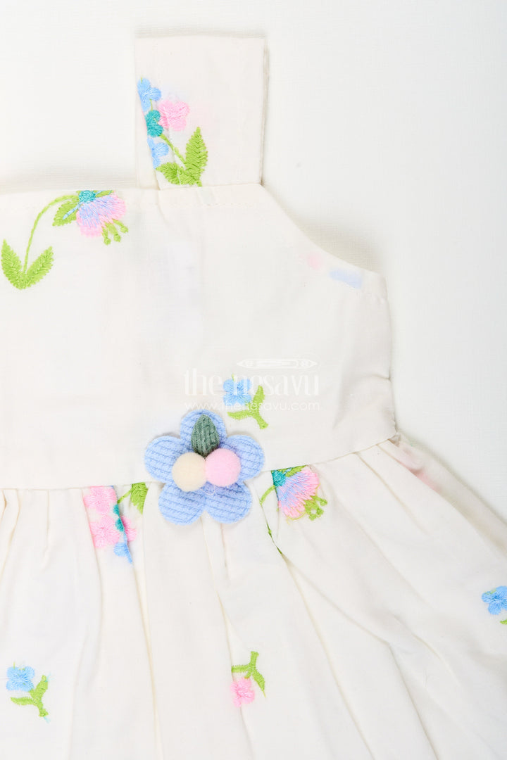 The Nesavu Baby Cotton Frocks White cotton frock with floral embroidery and shoulder straps for baby girls Nesavu Nesavu white cotton frock for baby girls with shoulder straps and colorful floral embroidery