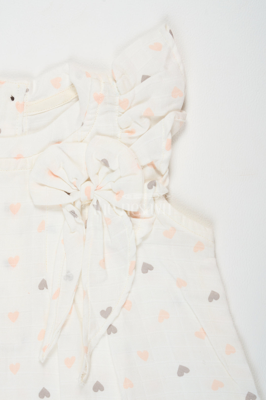 The Nesavu Girls Cotton Frock White Cotton Frock with Heart Print and Ruffle Sleeves, Double Cloth Muslin Girls Dress for Special Occasions Nesavu Nesavu Girls White Cotton Frock Heart Print Ruffle Sleeves Double Cloth Muslin Dress Special Occasions