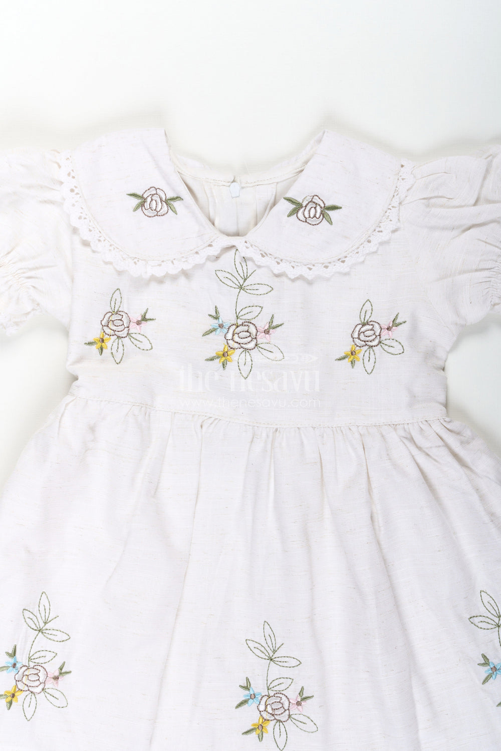 The Nesavu Girls Cotton Frock White Cotton Frocks for Girls with Floral Embroidery Puff Sleeves and Peter Pan Collar Nesavu Nesavu White Cotton Frocks for Girls with Embroidery Puff Sleeves and Peter Pan Lace Collar