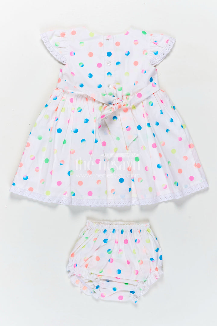 The Nesavu Baby Cotton Frocks White Newborn Clothes in Cotton with Neon Polka Dot Print and Frilly Sleeves for Baby Girls Nesavu Nesavu White Cotton Newborn Clothes Neon Polka Dots Lace Trimmed Sleeves Baby Girls