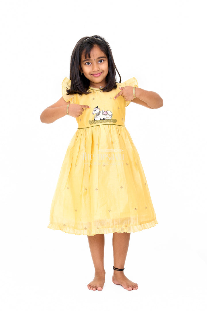 The Nesavu Girls Chanderi Frock Yellow Chanderi Cotton Frock with Pichwai Cow Embroidery – Adorable Traditional Attire for Girls Nesavu Yellow Chanderi Cotton Frock Girls Pichwai Cow Embroidery Traditional Festive Wear Nesavu
