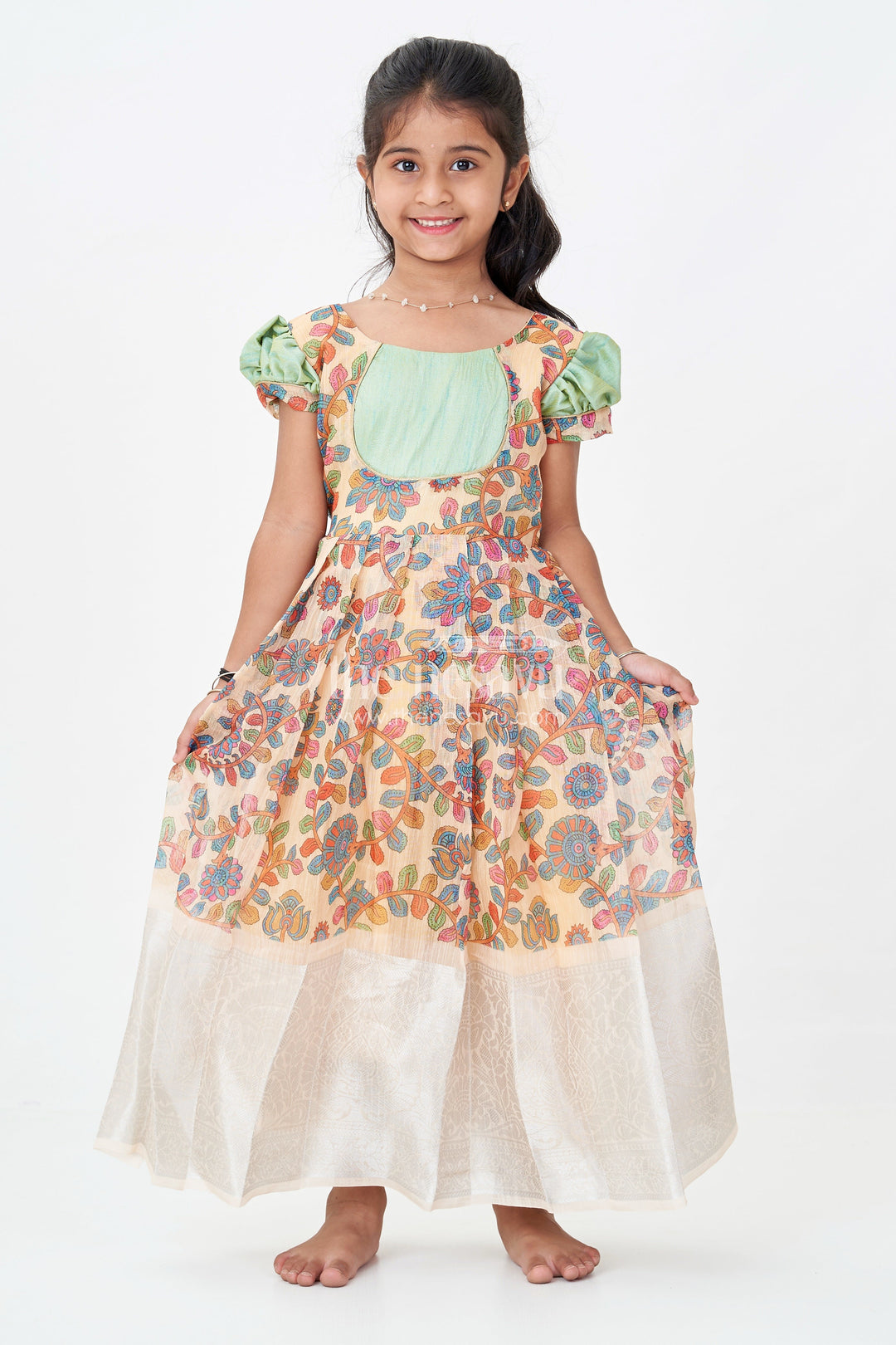 The Nesavu Girls Silk Gown Yellow Gown Dress for Girls with Embroidered Floral Motifs and Raw Silk Yoke in Chanderi Cotton Blend Nesavu Yellow Gown Dress Girls Chanderi Cotton Raw Silk Yoke Floral Embroidery | The Nesavu