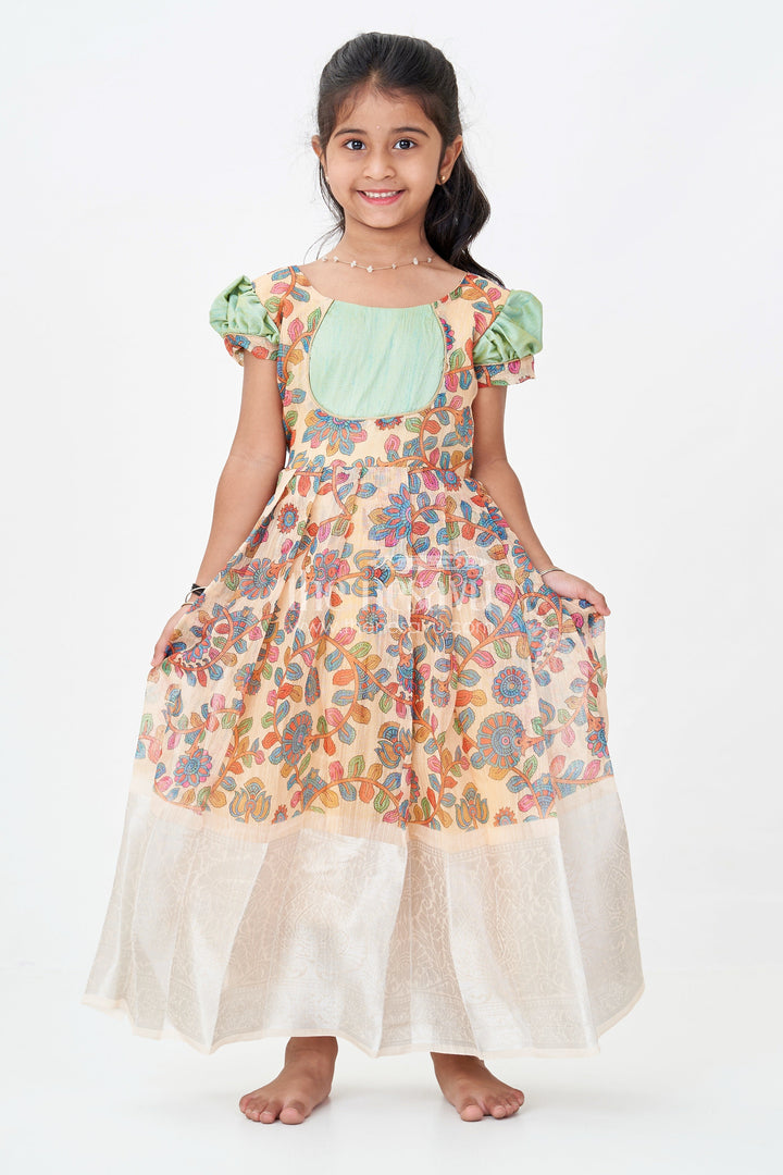 The Nesavu Girls Silk Gown Yellow Gown Dress for Girls with Embroidered Floral Motifs and Raw Silk Yoke in Chanderi Cotton Blend Nesavu Yellow Gown Dress Girls Chanderi Cotton Raw Silk Yoke Floral Embroidery | The Nesavu