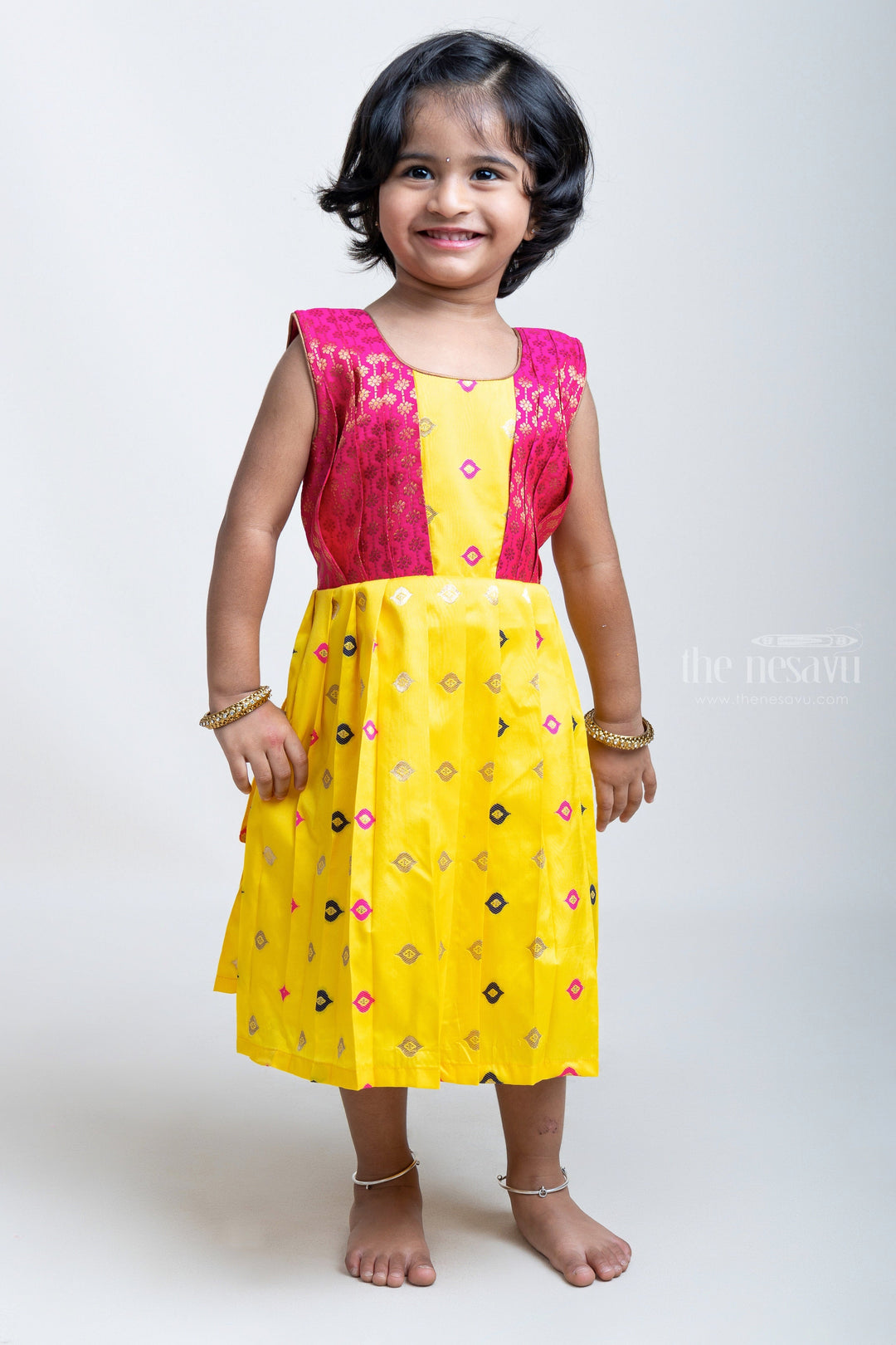 The Nesavu Silk Frock Yellow Pleated Semi-Silk with Red Designer Yoke Frock For Girls Nesavu Latest Model Frocks Designs | The Nesavu | Silk Frock Collection