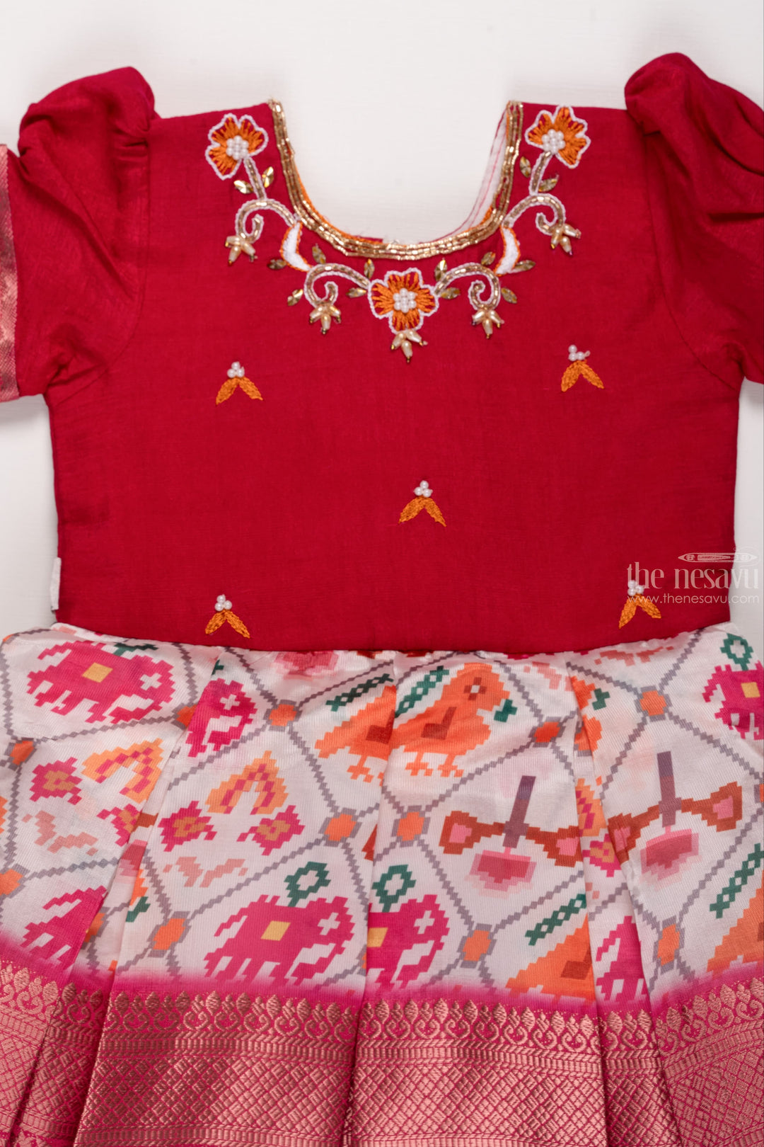 The Nesavu Silk Party Frock Zari-Embellished Maroon Silk Frock: Animal Motif Print with Luxurious Banarasi Border for Girls Nesavu Animal Motif Printed Silk Frock | Vibrant Geometric Prints | Festive & Traditional Attire