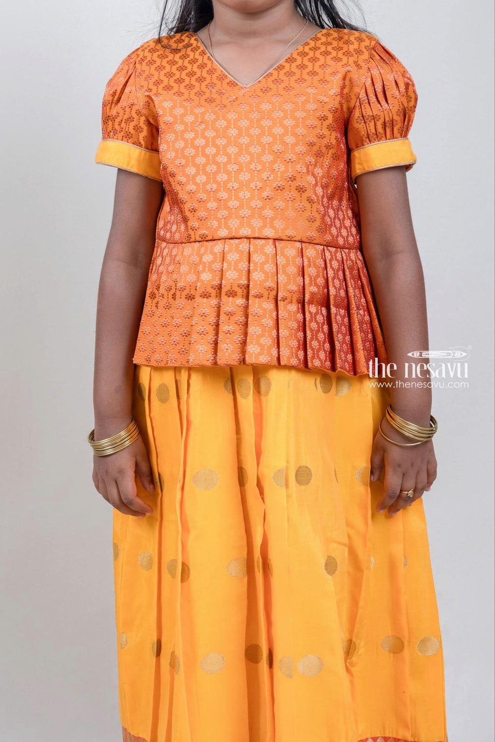 The Nesavu Pattu Pavadai Zari Floral Designer Yellow Silk Peplum Blouse N Knife Pleated Yellow Silk Skirt With Small Border for Girls Nesavu Ethnic Zari Floral Designer Yellow Silk Peplum Blouse with Knife Pleated Yellow Silk Skirt for Girls | Shop at The Nesavu