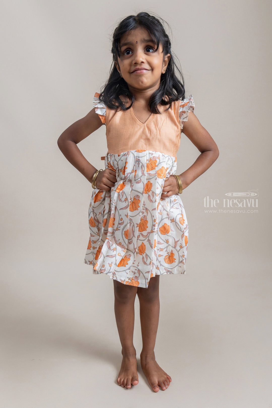 The Nesavu Frocks & Dresses Adorable Muted Orange And White Floral Printed Pleated Cotton Frock For Girls psr silks Nesavu 12 (3M) / Orange GFC750C