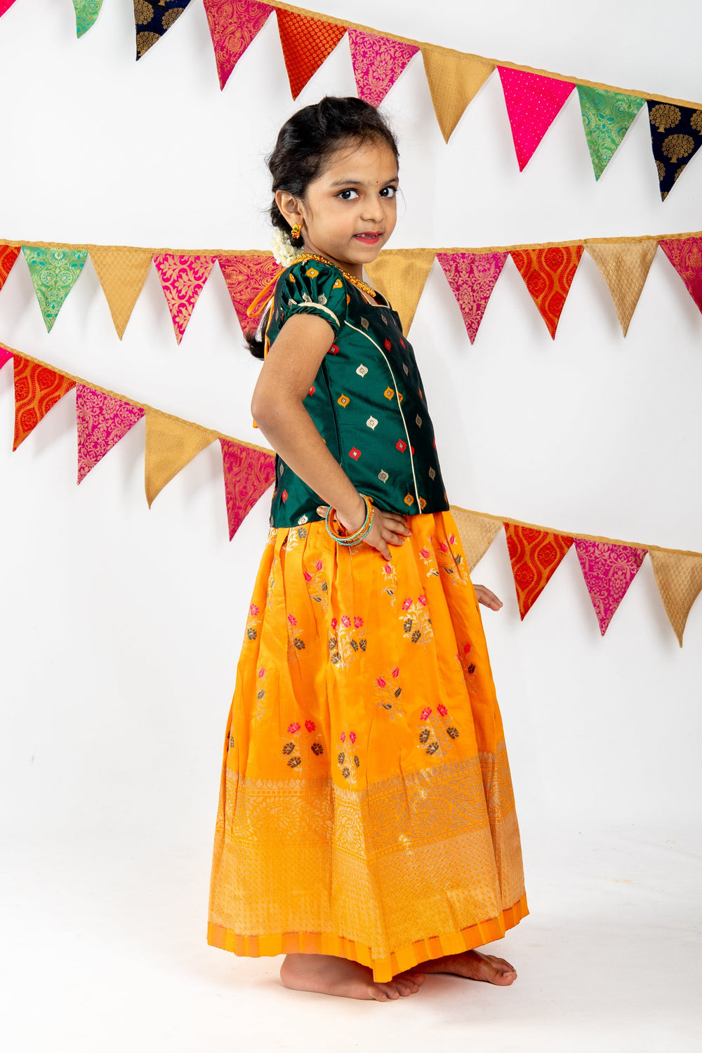 The Nesavu Pattu Pavadai Bright Orange With Green Banarasi Silk Pattu Langa Voni For Girls psr silks Nesavu